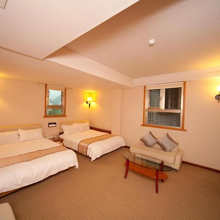 Tian Long Hotel Цзяоси Экстерьер фото