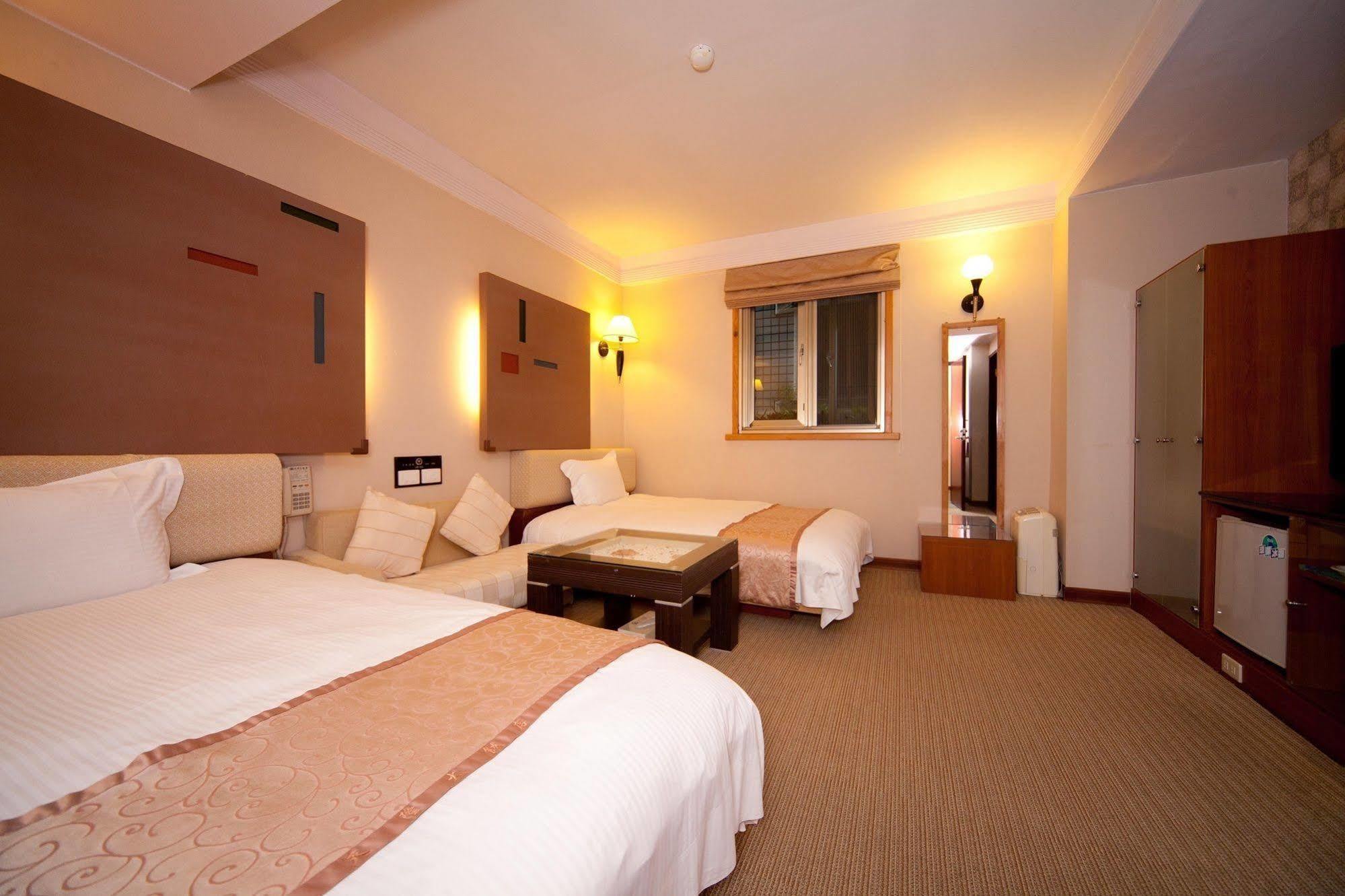 Tian Long Hotel Цзяоси Экстерьер фото